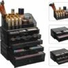 BeautyStorage Luxe Acryl Makeup Cosmetica Organizer - Met 4 Laden - Sieraden Makeup Cosmetica Opbergsysteem Organiser Display Houder - Lippenstift - Nagellak - Lippenstift - Brushes Visagie - Make-up Kastje - Transparant Zwart -Essie winkel 550x466 2